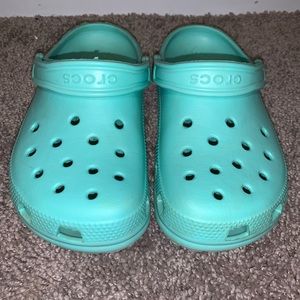 mint green crocs
